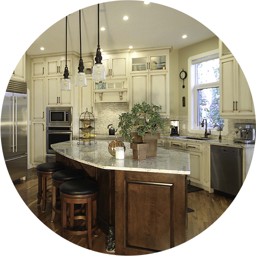 A kitchen with a large island and wooden cabinets.