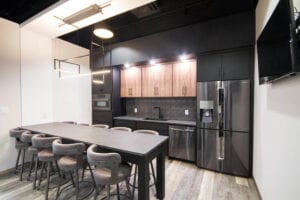 A dining area with black cabinets