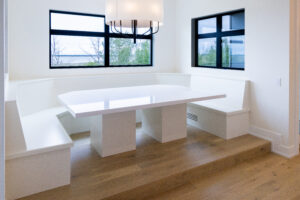 A modern dining table in glossy white color