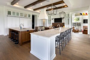 An interior of a house with wooden flooring and white interiors