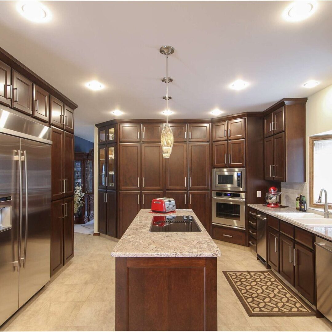 A kitchen with brown cabinets and white counters.